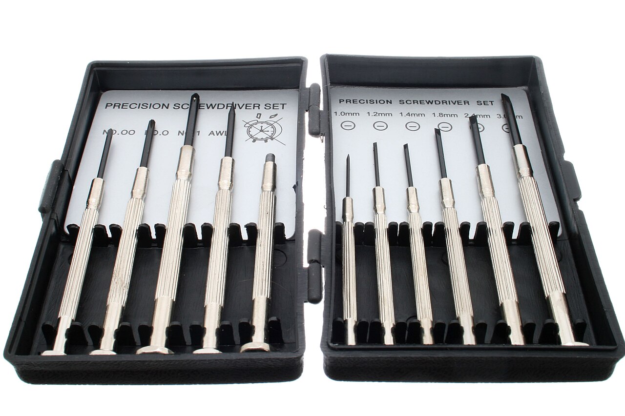 A folding case of precision screwdriver bits used on a repair bench